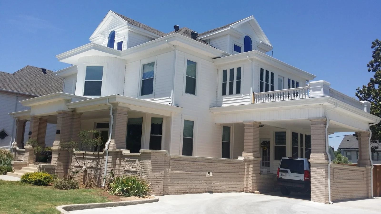 Same two-story home after new windows and siding by Terrell's
